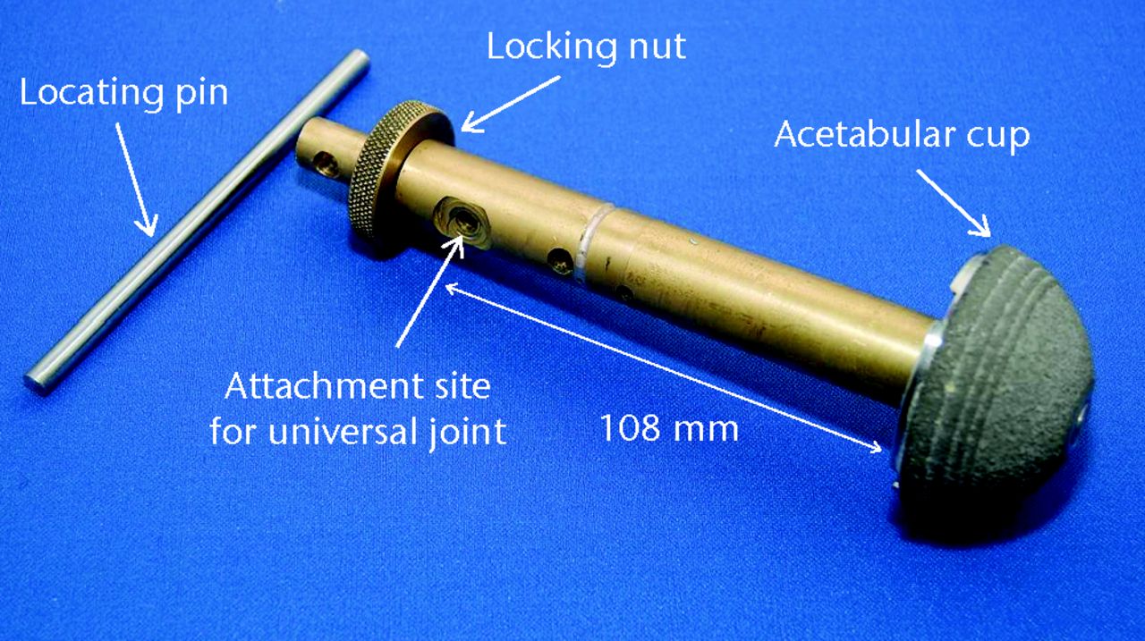 Fig. 1 
            Photograph showing the peripheral self-locking
(PSL) Trident acetabular component (Stryker, Newbury, United Kingdom) mounted
on the brass rod connecting assembly used to secure the component
to the load cell.
          