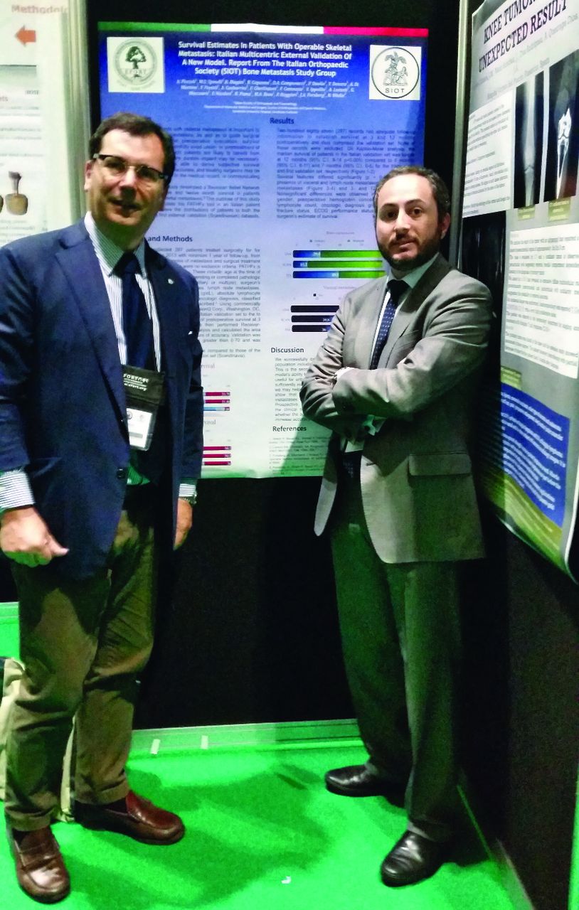 Fig. 1 
        Alberto (right) at the BOA/EFORT Congress, together with the Secretary of the Italian Orthopaedic Society - SIOT (Dr. A. Piccioli), during the presentation of a poster regarding a study of the “Italian Orthopaedic Society Bone Metastasis Study Group”.
      