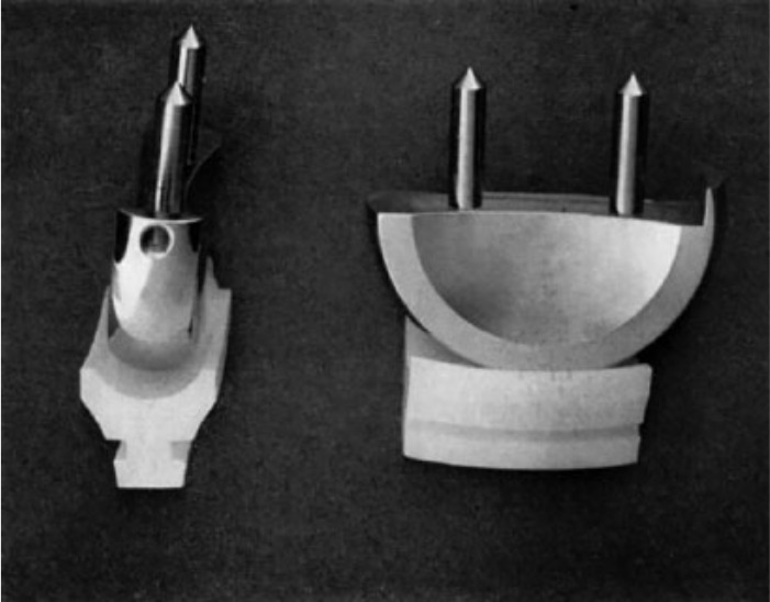 Fig. 3 
            Photograph of the Gunston knee. Reprinted from Gunston FH. Polycentric knee arthroplasty: prosthetic simulation of normal knee movement. J Bone Joint Surg [Br] 1971;53-B:272-277.
          