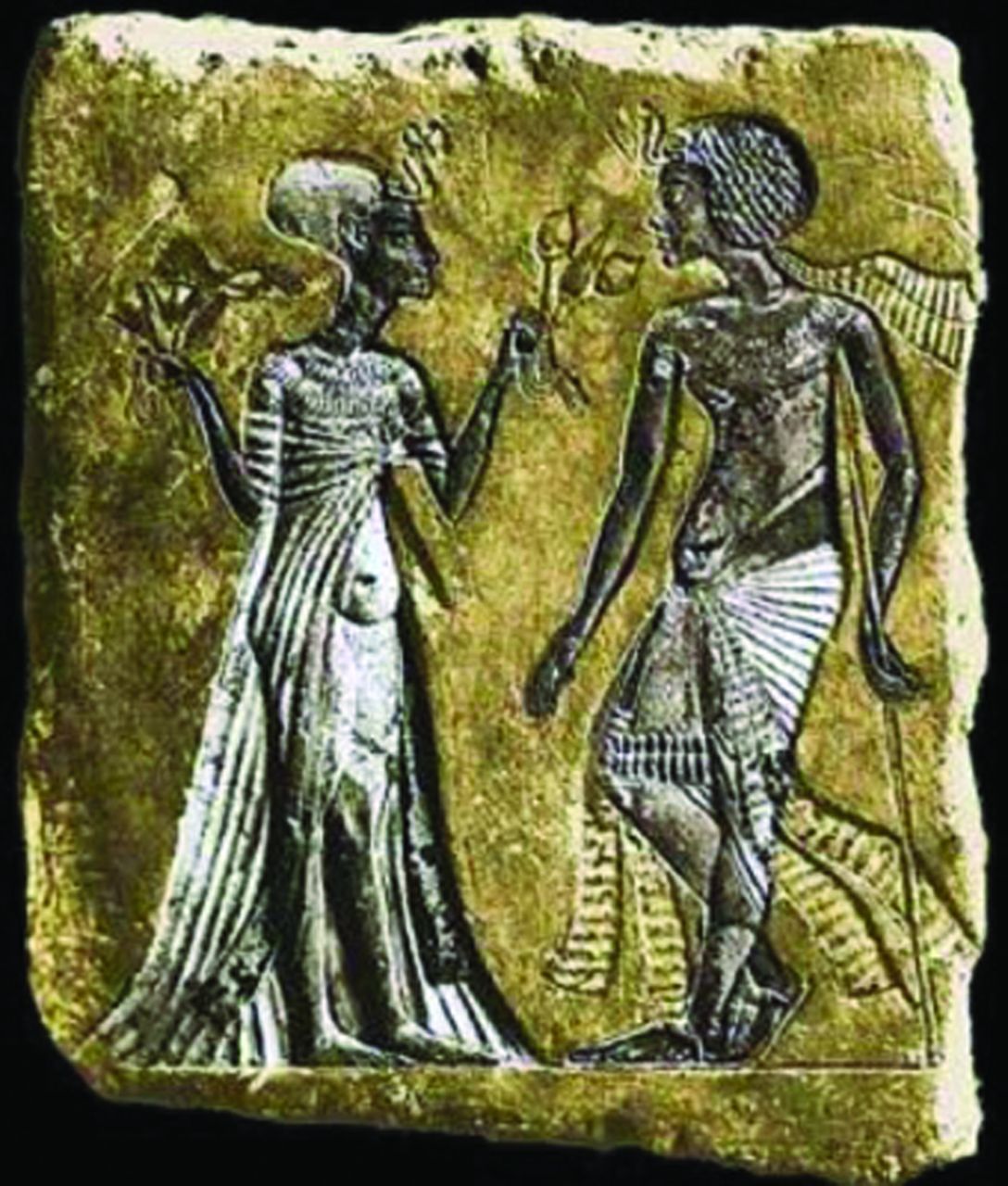 Fig. 9 
          Stele thought to be of Tutankhamun using a walking staff – note the short, thin left leg.
        
